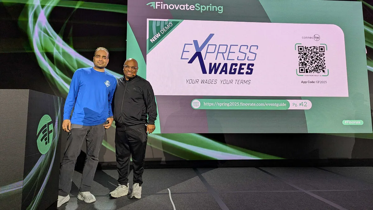 Rakesh Maskara and Alfred Milan on stage at FinovateSpring 2025 in front of the Express Wages demo screen